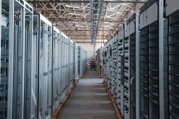 server room aisle with metal equipment racks
